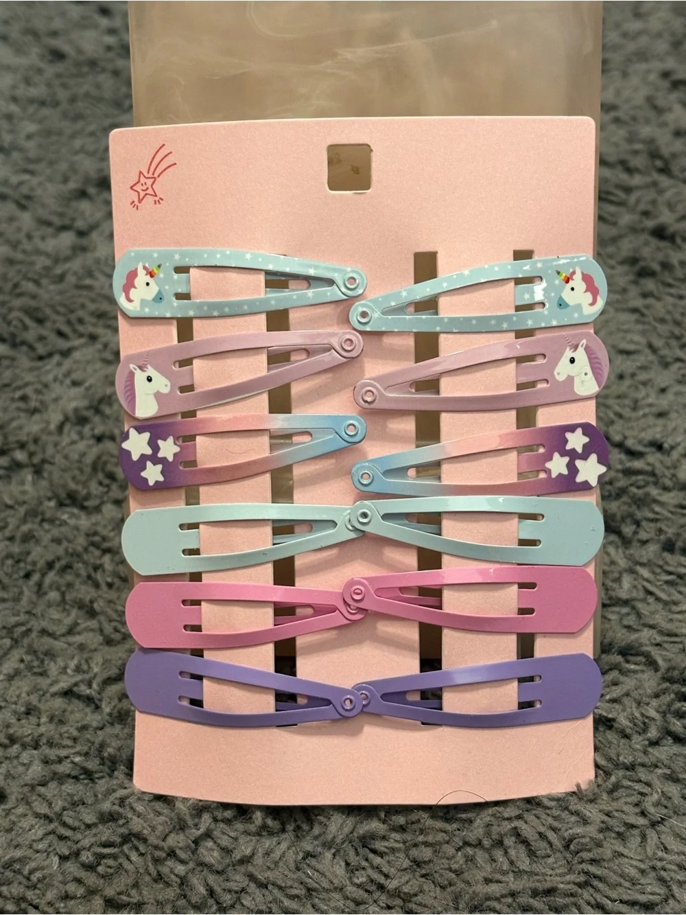 NWT set of 12 blue, pink, and blue hair clips with unicorns and stars as decor